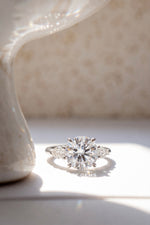 Round Shape Ring - Pear Side Stone 3 Stone Setting